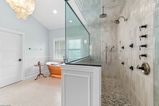 bathroom with lofted ceiling and separate shower and tub