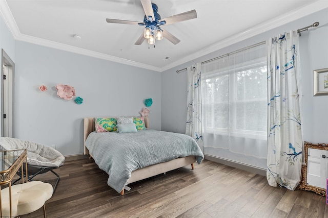 bedroom with crown molding, ceiling fan, and hardwood / wood-style floors