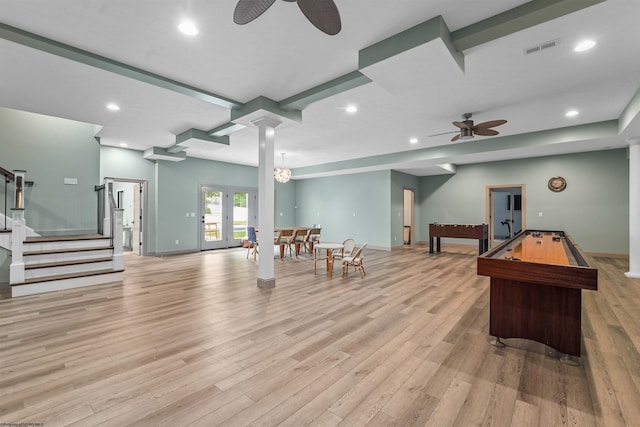 game room with light wood-type flooring, ornate columns, and ceiling fan