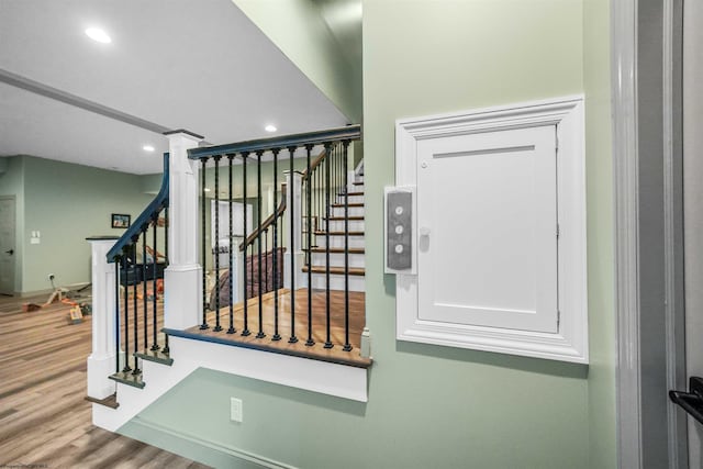 stairway with wood-type flooring