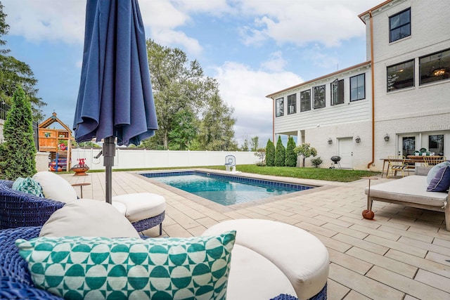 view of swimming pool with a patio area