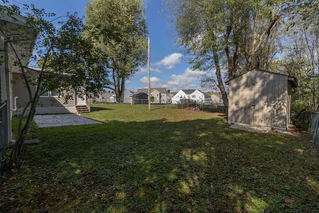 view of yard with a storage shed