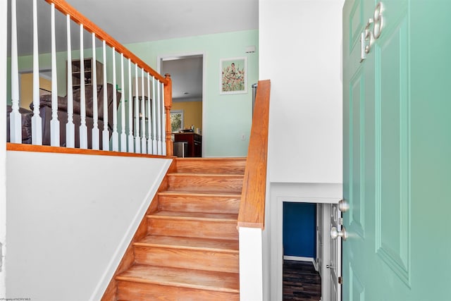 stairway featuring hardwood / wood-style flooring