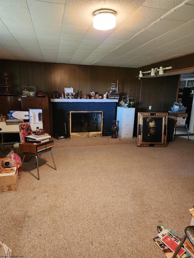 413 Green Acres Cir, Spencer, WV 25276 - carpeted living area with wood walls and a brick fireplace