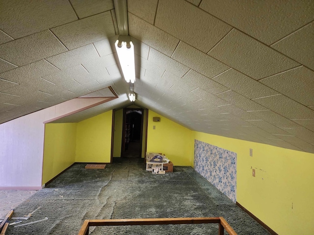 413 Green Acres Cir, Spencer, WV 25276 - additional living space with lofted ceiling, carpet flooring, and baseboards