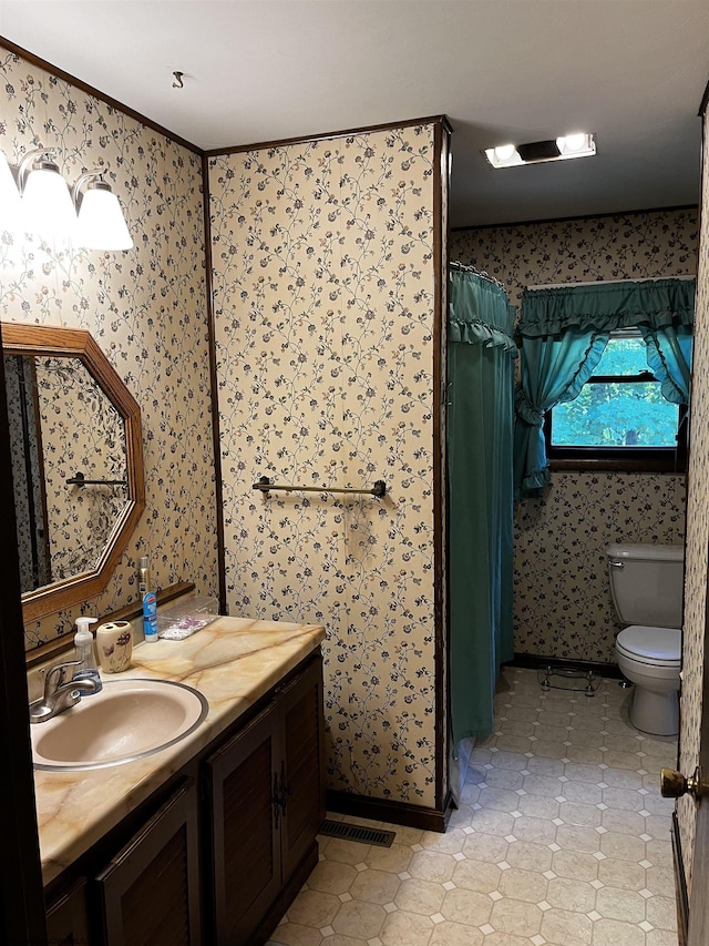 bathroom with vanity and toilet