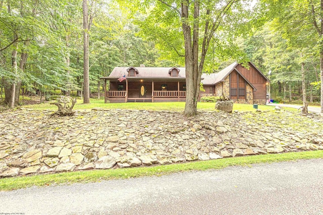 view of front of home with a wooden deck