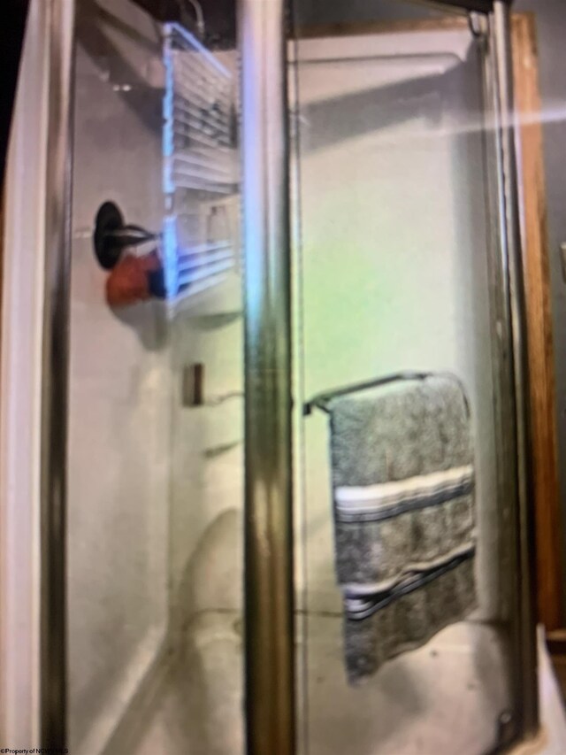 interior details featuring a shower stall