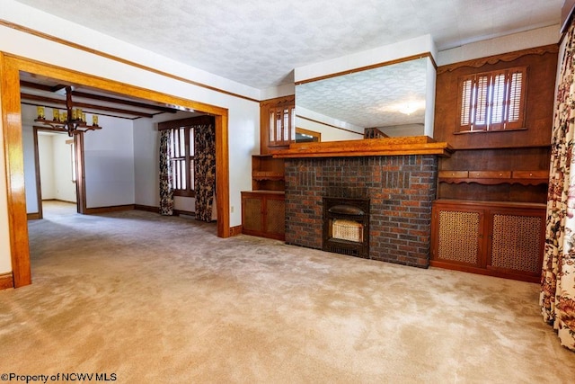 unfurnished living room featuring a fireplace, a textured ceiling, and carpet floors