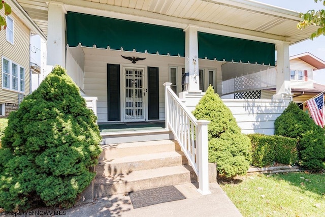 doorway to property with covered porch