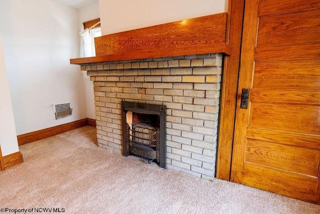 details featuring a brick fireplace and carpet