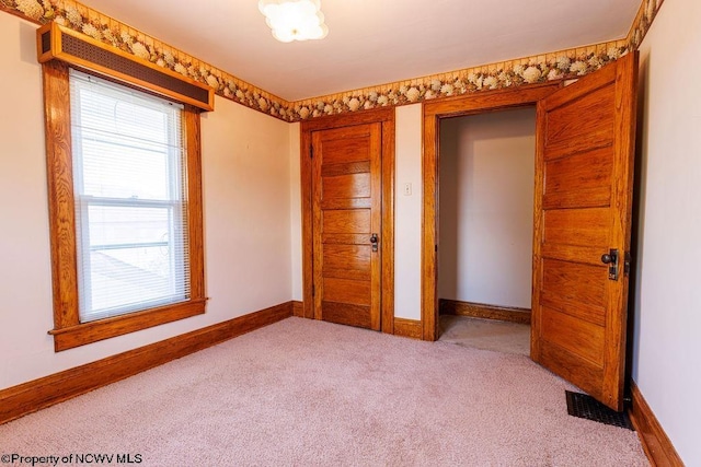 unfurnished bedroom featuring carpet flooring