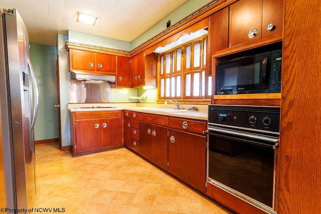 kitchen featuring black appliances and sink