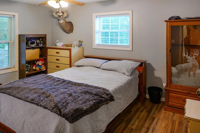 bedroom featuring ceiling fan and dark hardwood / wood-style flooring