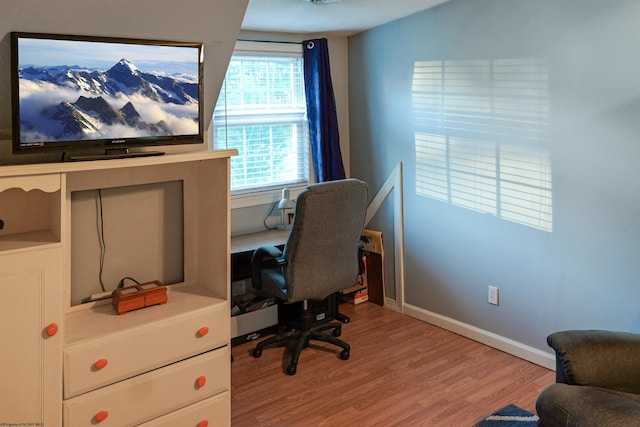 office space with light wood-type flooring