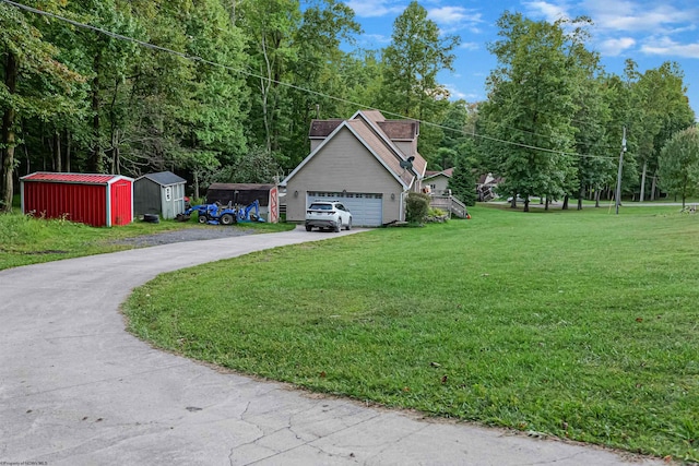 view of yard with a garage and a shed