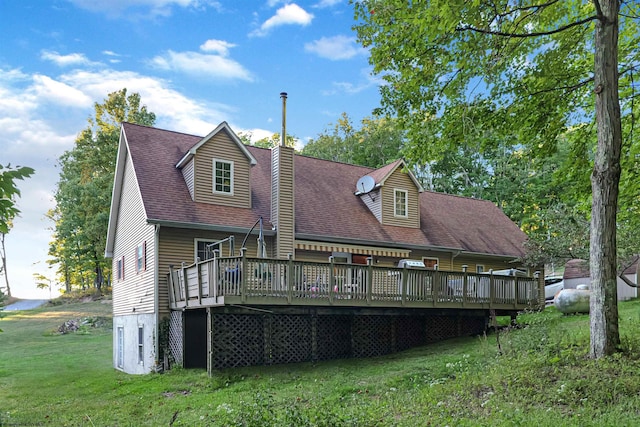 back of house featuring a yard and a deck