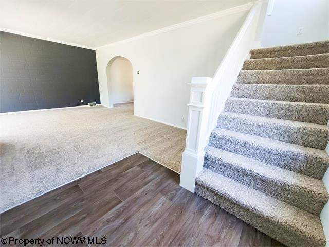 stairway featuring hardwood / wood-style flooring