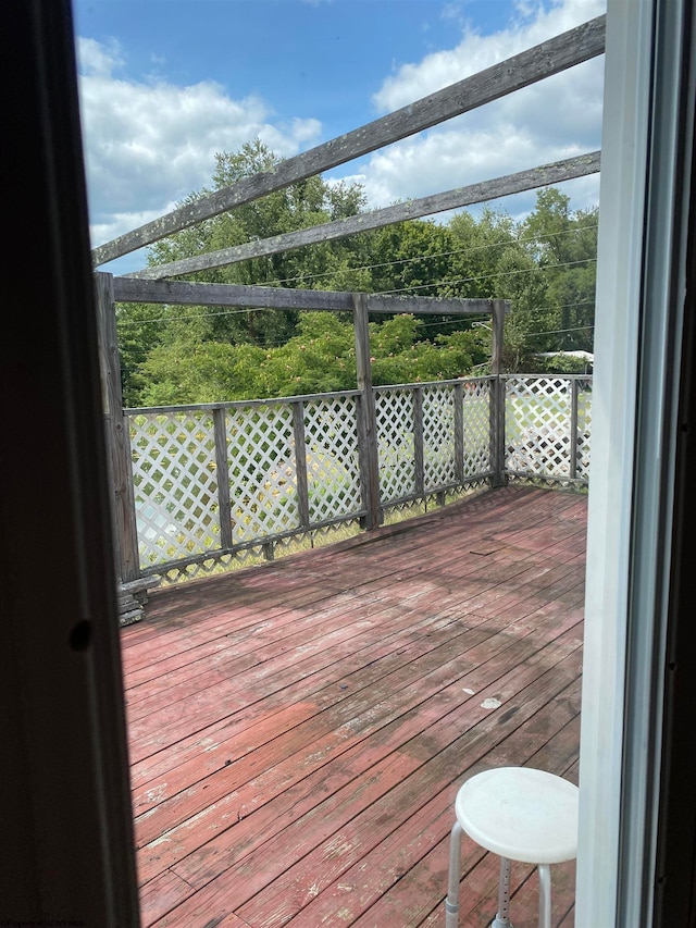 wooden deck with a water view