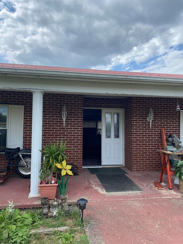 doorway to property featuring a porch