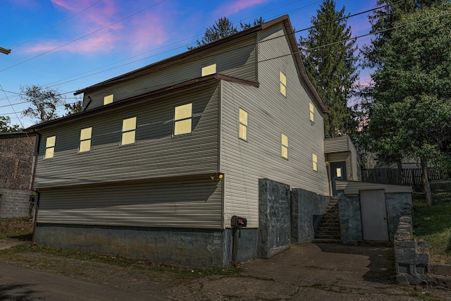 view of property exterior at dusk