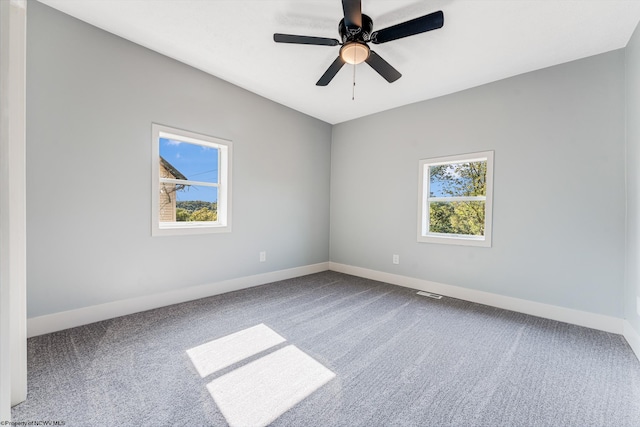 spare room with ceiling fan and carpet floors