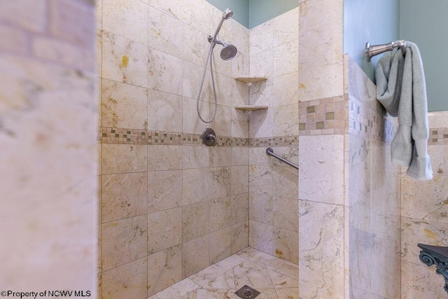 full bathroom with tiled shower