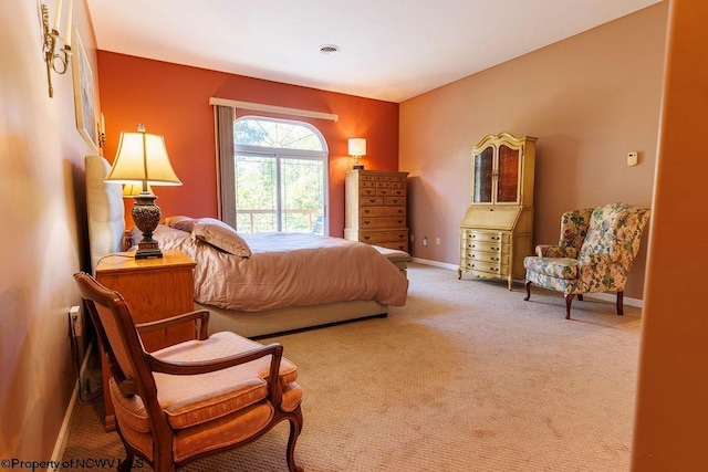 bedroom featuring carpet flooring, visible vents, and baseboards