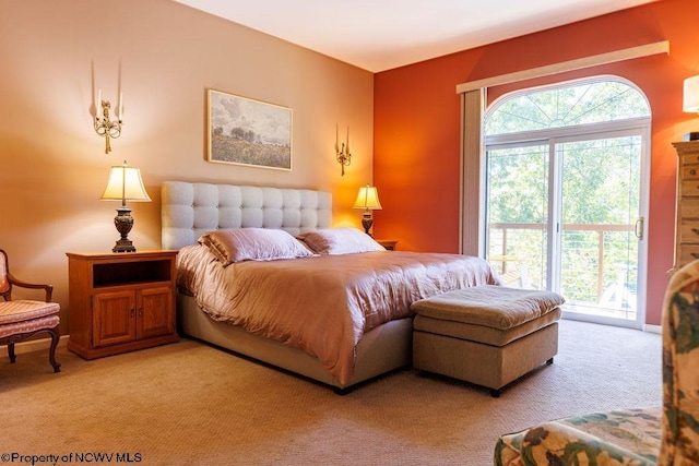 bedroom featuring access to outside, multiple windows, baseboards, and light carpet