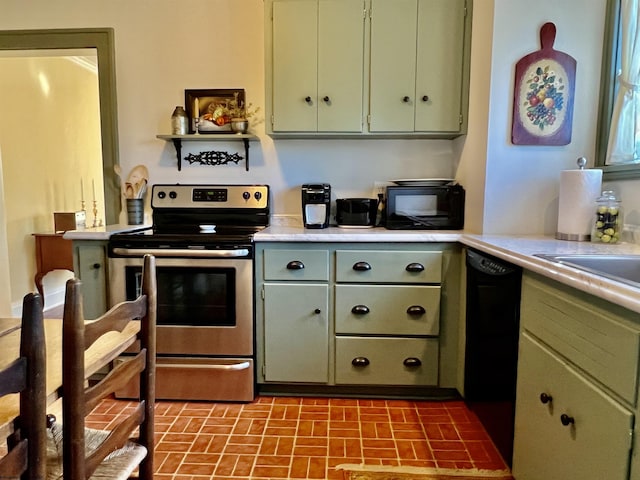 kitchen featuring green cabinets, black appliances, and light countertops