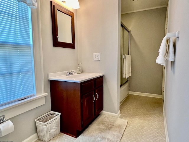 bathroom with vanity and a shower with shower door