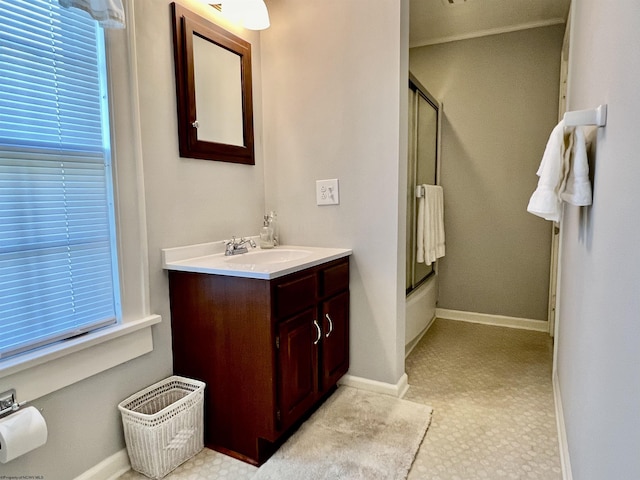 bathroom with vanity and baseboards