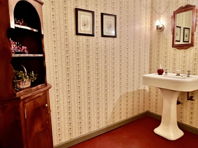 bathroom with wallpapered walls