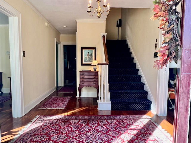 staircase featuring crown molding, hardwood / wood-style floors, and an inviting chandelier