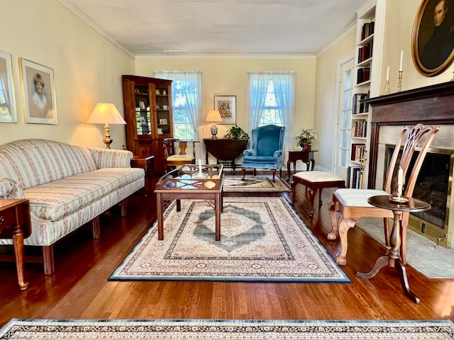 living room featuring crown molding and hardwood / wood-style flooring