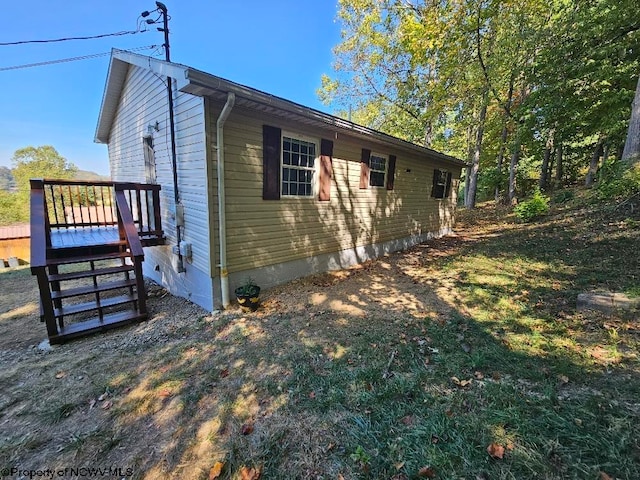 view of home's exterior featuring a deck