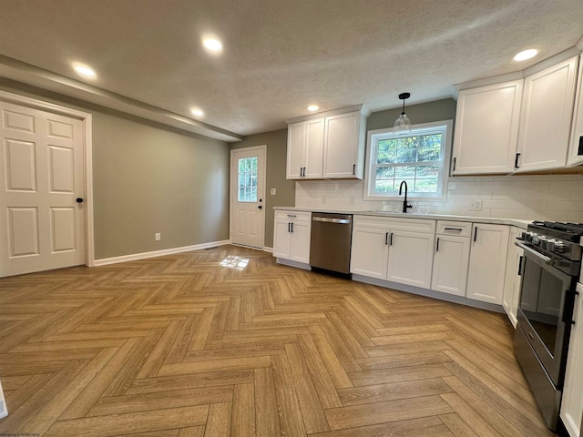 kitchen with a textured ceiling, pendant lighting, stainless steel appliances, decorative backsplash, and white cabinets