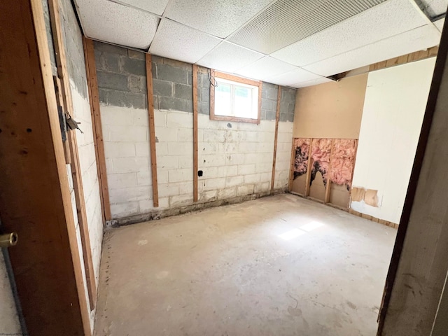 basement featuring a drop ceiling