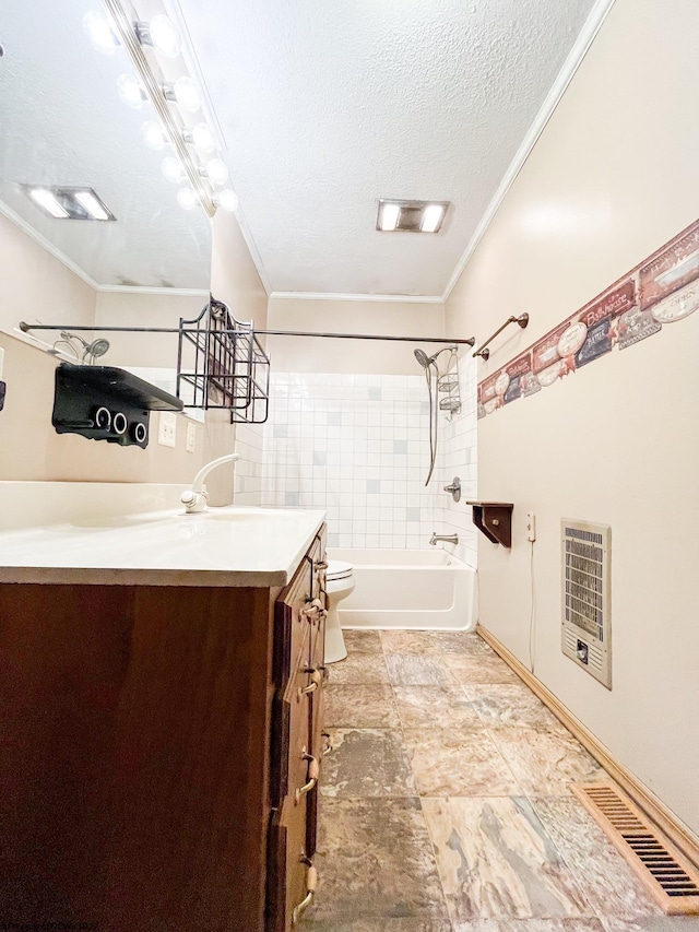 full bathroom featuring a textured ceiling, vanity, toilet, tiled shower / bath combo, and heating unit