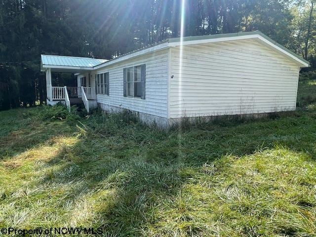 view of property exterior with a porch