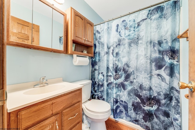 bathroom with vanity, toilet, hardwood / wood-style floors, and a shower with shower curtain