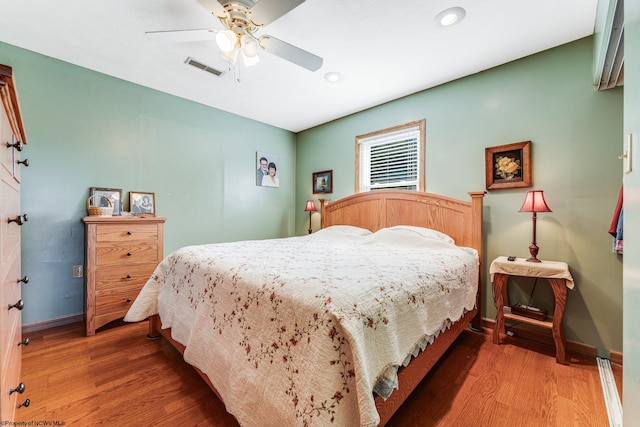 bedroom featuring wood-type flooring and ceiling fan