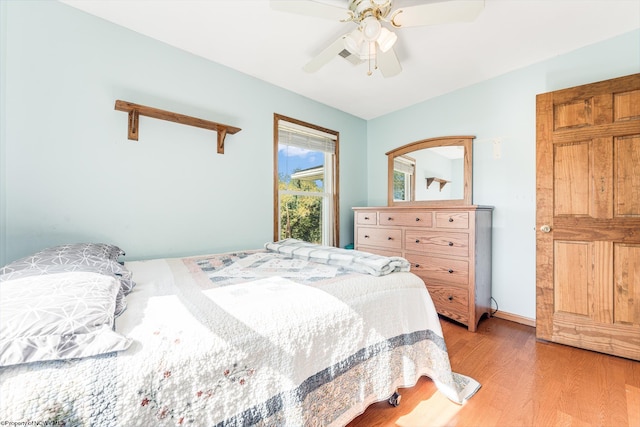 bedroom featuring light hardwood / wood-style flooring and ceiling fan