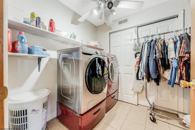 clothes washing area with ceiling fan, separate washer and dryer, and light tile patterned floors