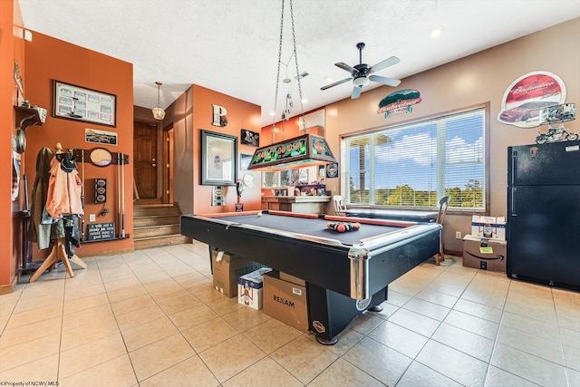 recreation room with light tile patterned flooring, billiards, a textured ceiling, and ceiling fan