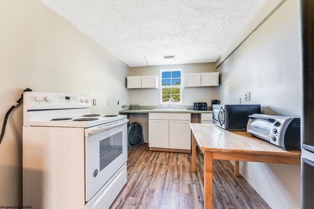 kitchen with a textured ceiling, sink, white electric range oven, white cabinets, and light hardwood / wood-style floors