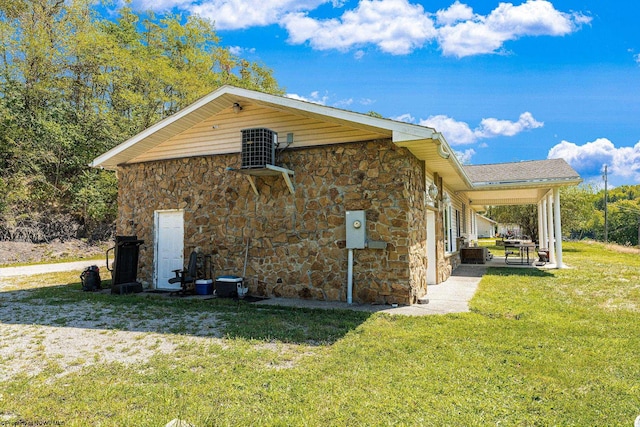 view of home's exterior featuring a lawn and cooling unit