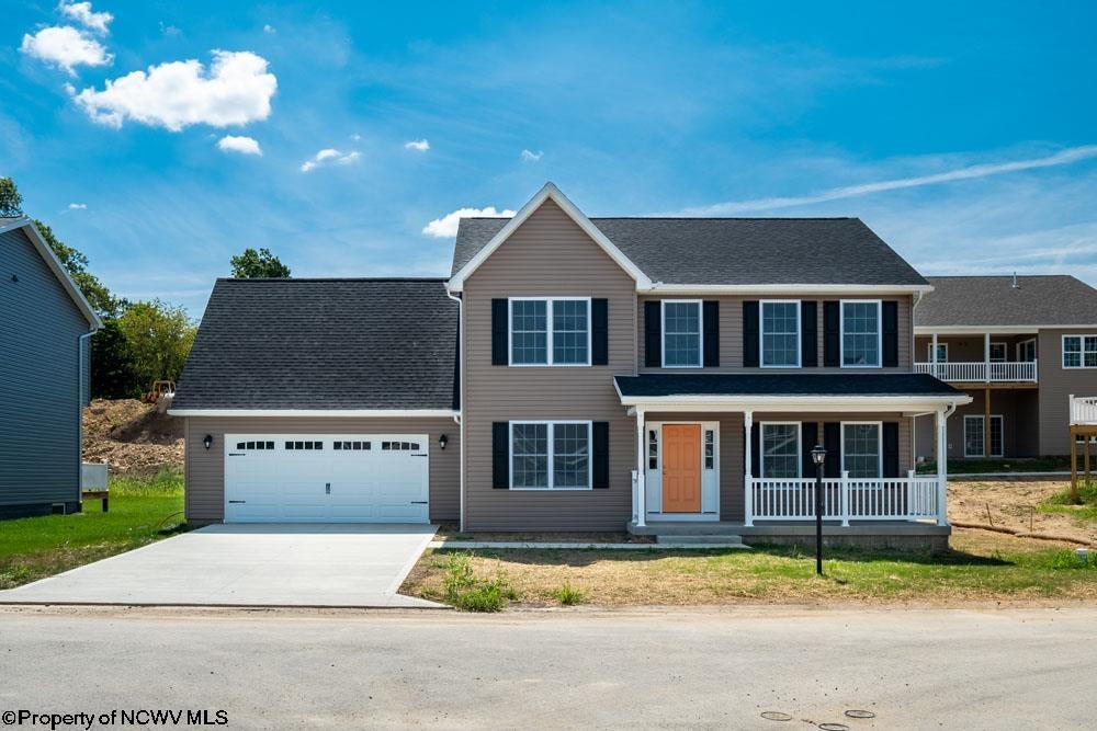 view of front of house with a garage and a porch