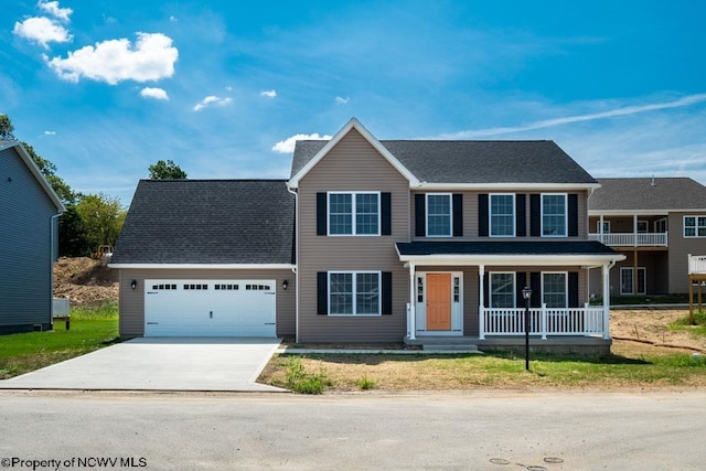 view of front of house with a garage and a porch