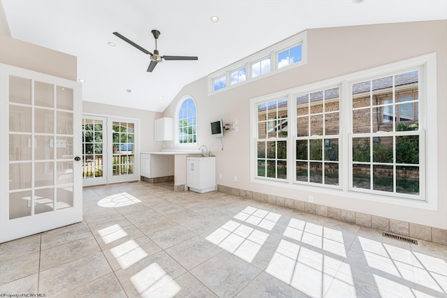 interior space featuring a ceiling fan, visible vents, recessed lighting, vaulted ceiling, and french doors